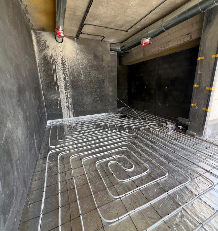 Underfloor heating pipes laid before screed